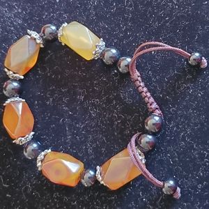 Brown and yellow adjustable string beaded bracelet